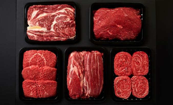 Different types of red meat in plastic boxes packaging tray