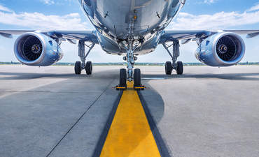 A shot from underneath an aircraft shows its turbines