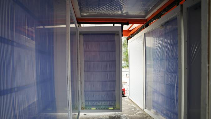 Cooling panels draw heat away from people standing nearby.