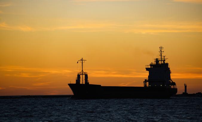 Cargo ship at sunset