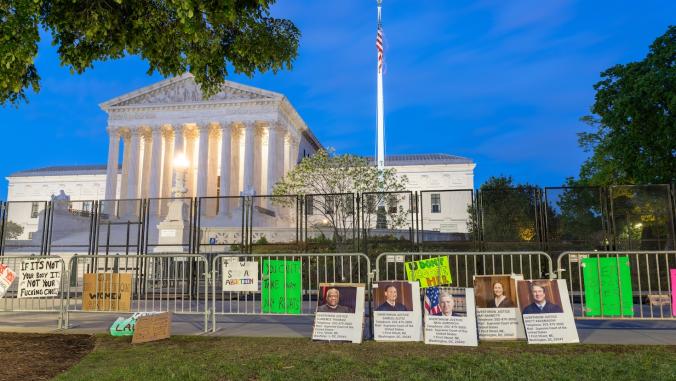 The Supreme Court of the United States with non-scalable fence.